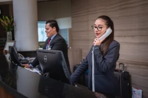 receptionists, phone call, hotel, reception, woman, man, work, attention, lobby, employees, professional, company, assistance, hotel, hotel, hotel, hotel, hotel, reception-5975962.jpg